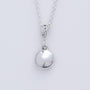 Argentium Silver Pebble Penant with a smooth bright white silver polish. On a mini silver belcher chain. 
