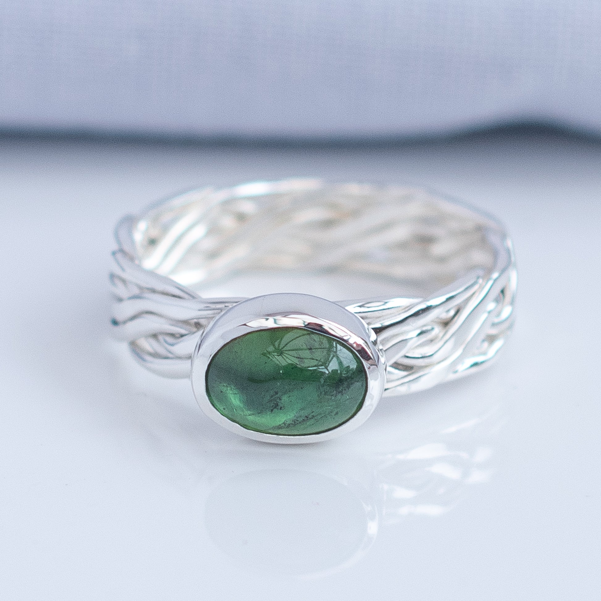 Green tourmaline woven Argentium silver ring handmade in the UK