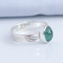 Sideview of natural mint green tourmaline set in textured Argentium silver