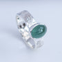 Side view of mint green tourmaline ring with textured Argentium silver