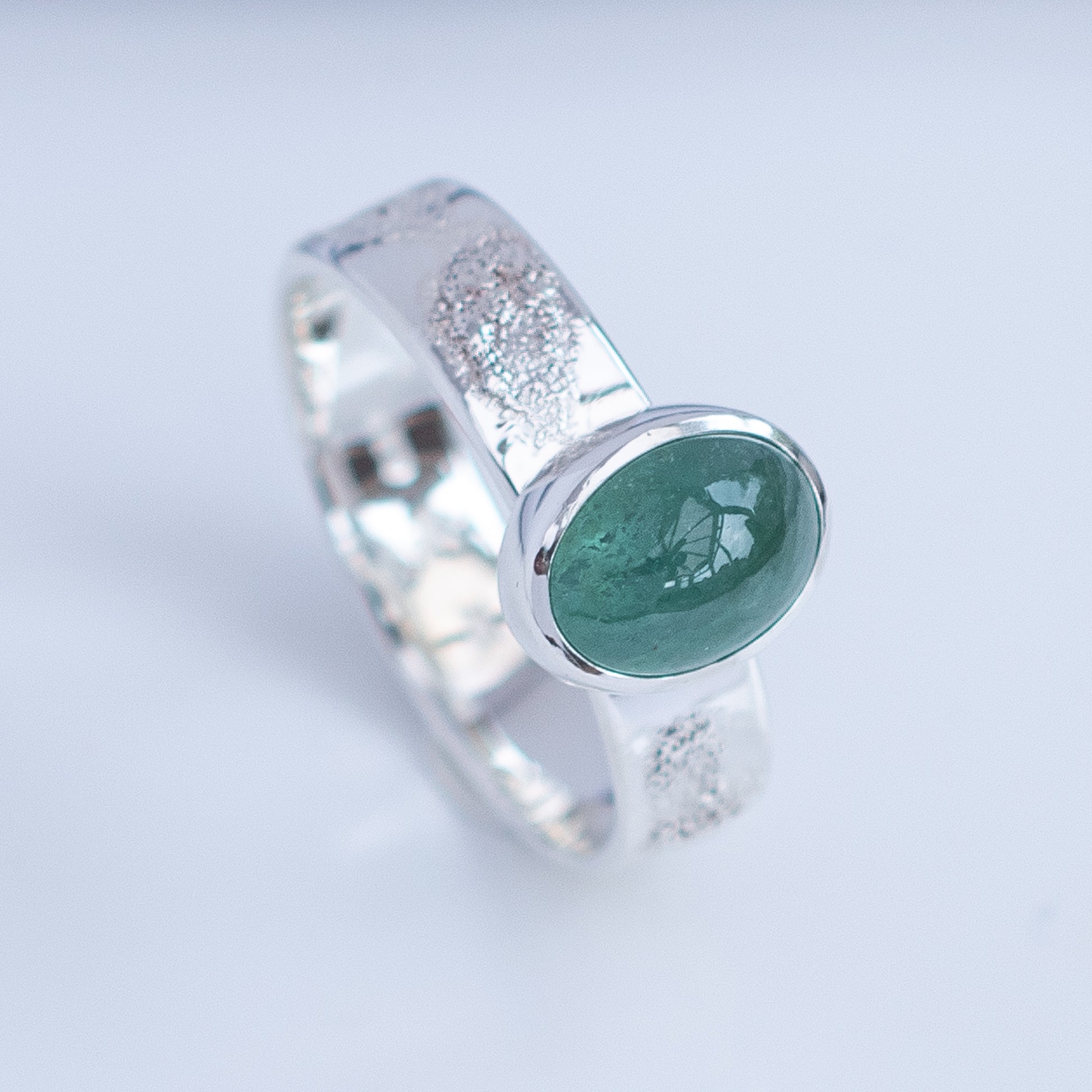Side view of mint green tourmaline ring with textured Argentium silver