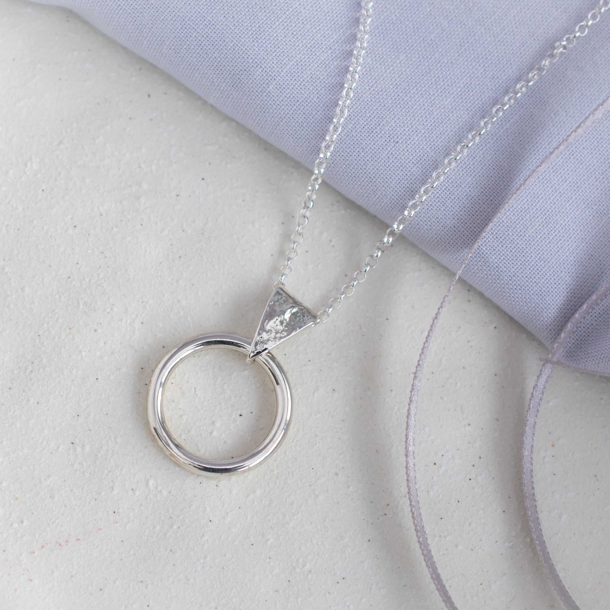Circle Pendant with Dust Texture in Argentium Silver