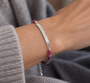 Natural rainbow spinel gemstone bracelet in muted pink, red, mauve and earthy tones with handcrafted silver bar
