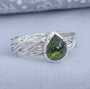 Olive green pear-shaped tourmaline ring with handwoven Argentium silver band