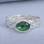 Handmade oval green tourmaline ring with woven Argentium silver band, UK size L